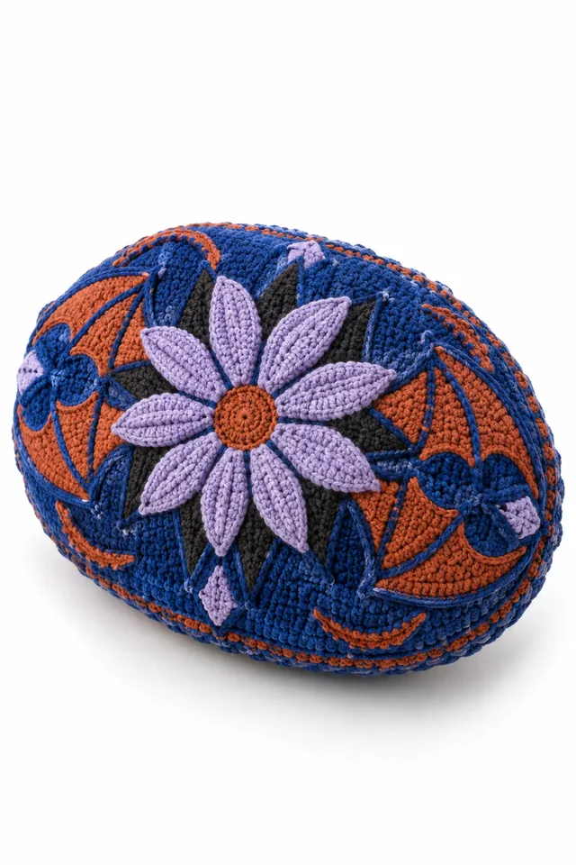 AI concept of a cobalt blue oval crochet cushion with bat wing scallops and compass petal pattern.